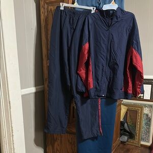 Blue and Red Windbreaker with Collared Neckline and Full-Zip Design